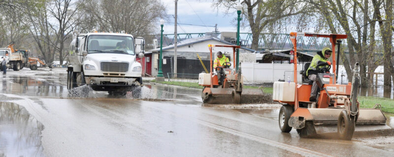 Cleaning UP: Volunteers, city help businesses bounce back after flood